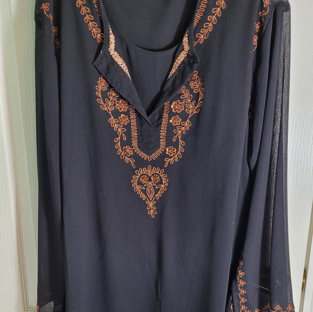 Black sheer top with sleeveless tank attached.